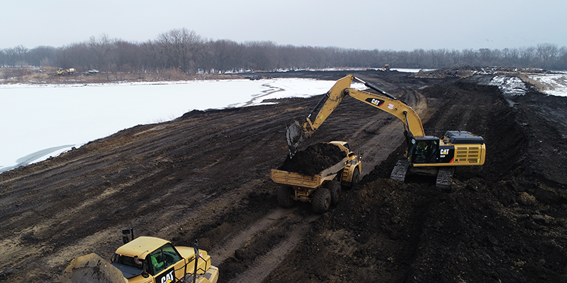 Our Crew Driving Earthwork Heavy Equipment on doing Morris Overburden Removal Project